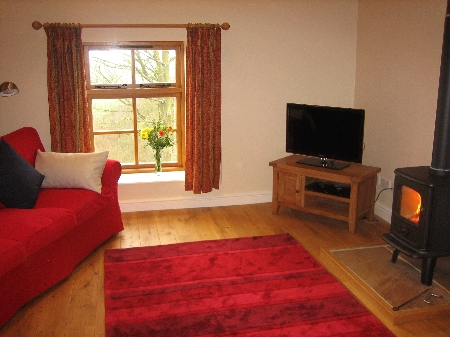 The Hayloft living room and wood-burning stove